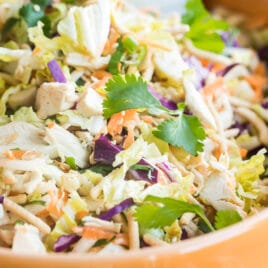 A bowl of Chinese chicken salad with Asian salad dressing.