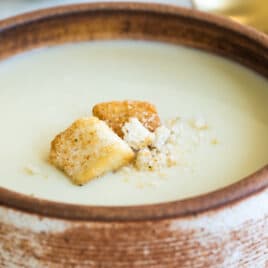 A bowl of Cream of Cauliflower Soup.