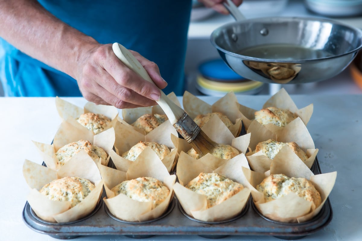 Lemon Poppy Seed Muffins baked in paper cups.