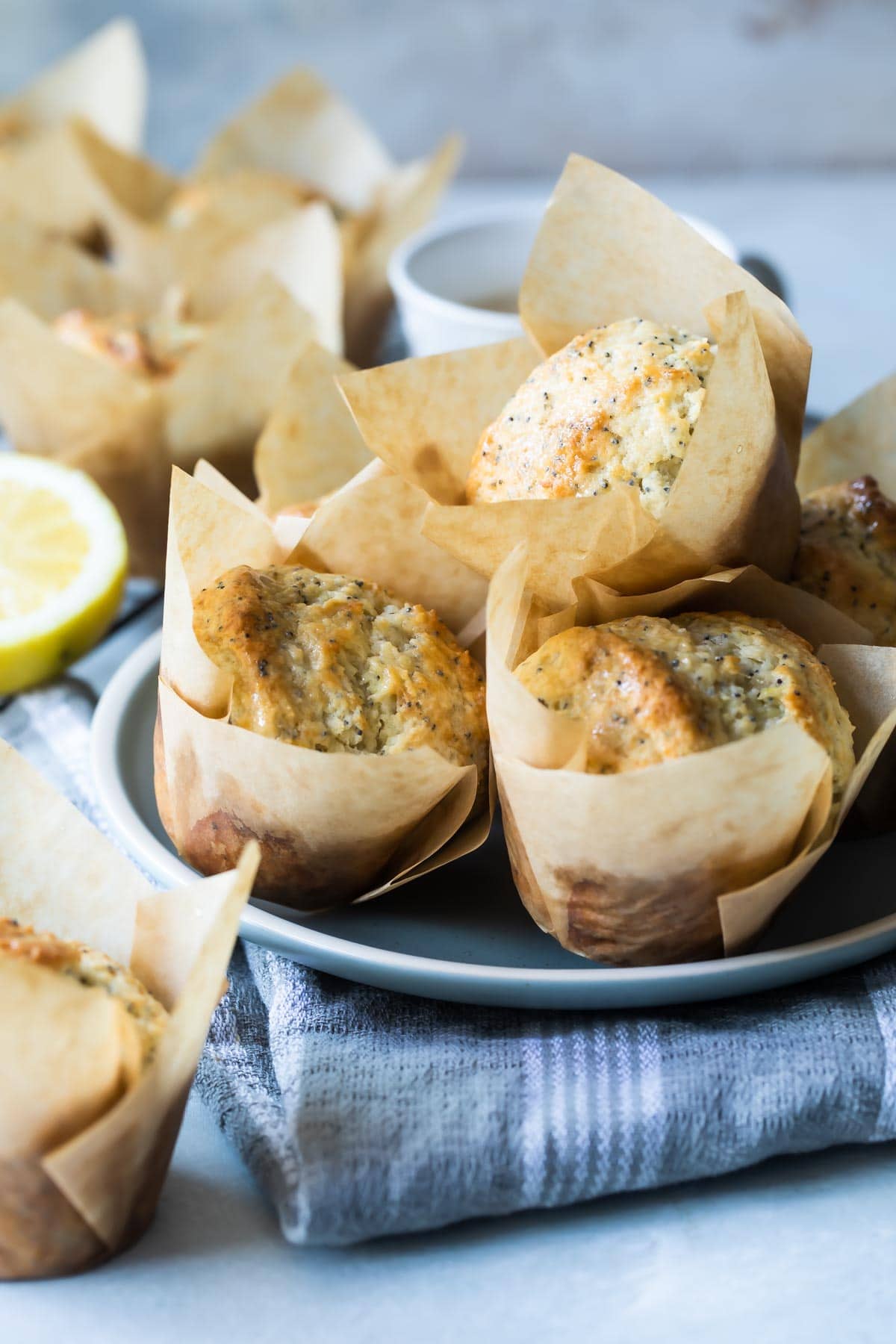Lemon Poppy Seed Muffins baked in paper cups.