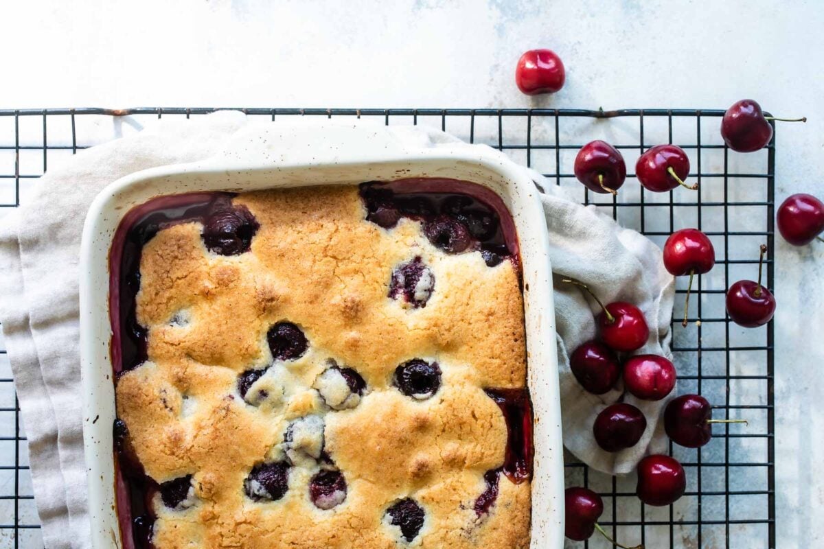 A baking dish with cherry cobbler.