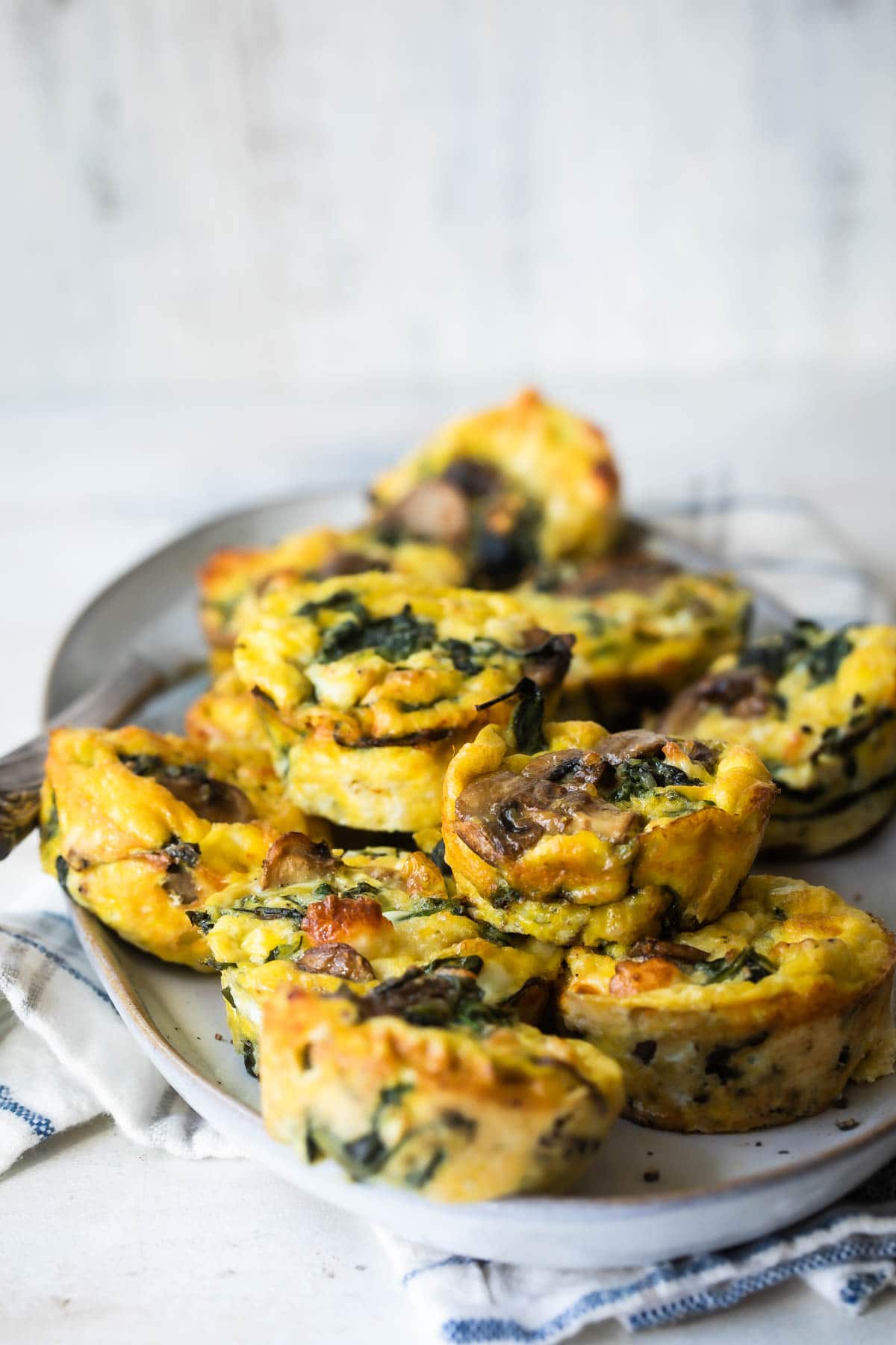 Egg muffins on a gray plate.