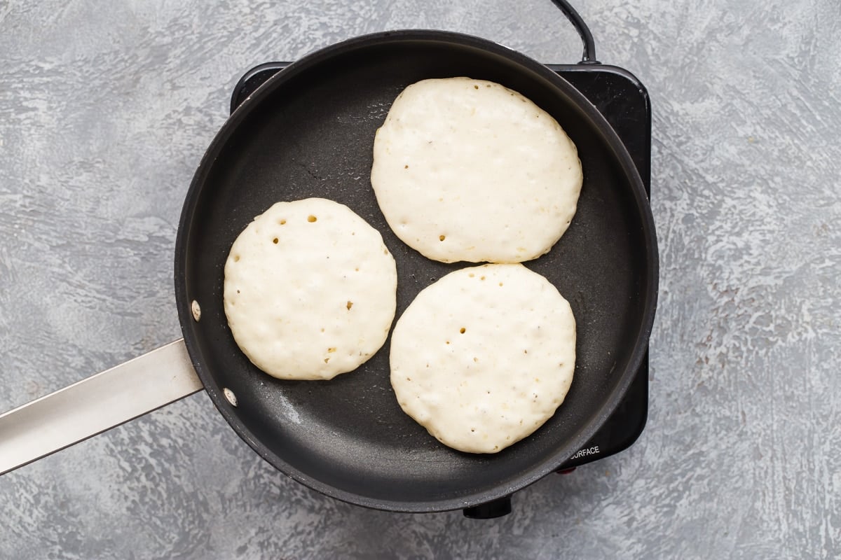 Cooking pancakes in a skillet.