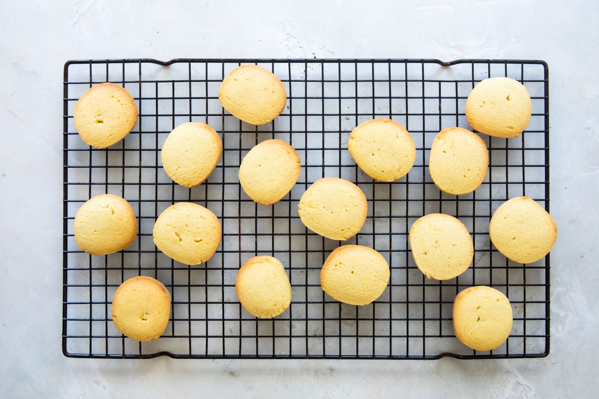 Lemon cookies on a cooling rack.