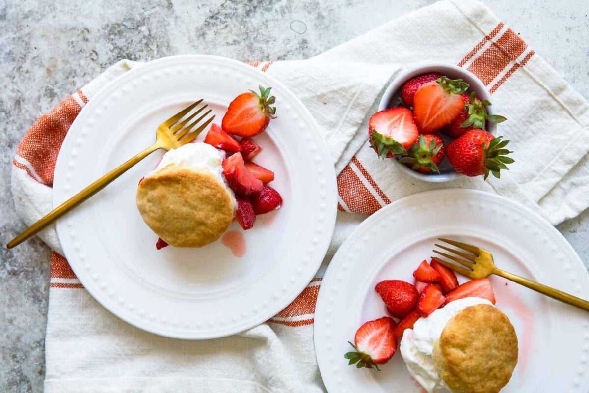 Strawberry shortcakes on a white plates.