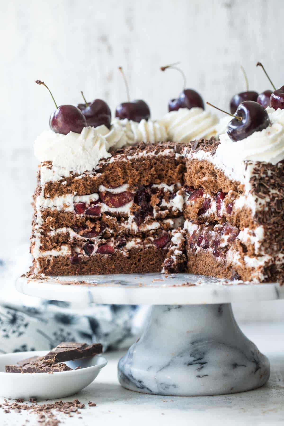 A Black Forest Cake with slices removed.