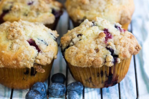 Blueberry muffins on a cooling rack.