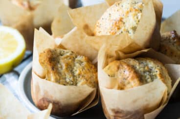 Lemon poppy seed muffins on a plate.