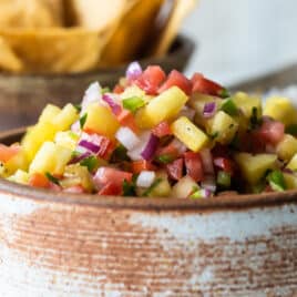 Pineapple Salsa in a brown bowl.