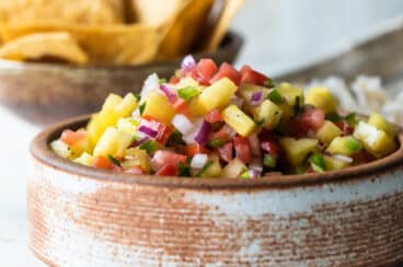 Pineapple Salsa in a brown bowl.