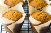 Pumpkin muffins on a cooling rack.