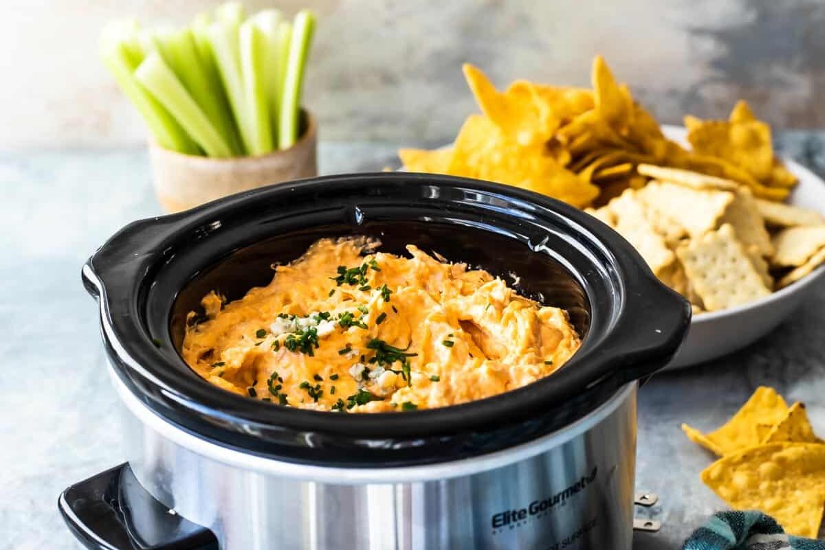 Buffalo chicken dip in a slow cooker.