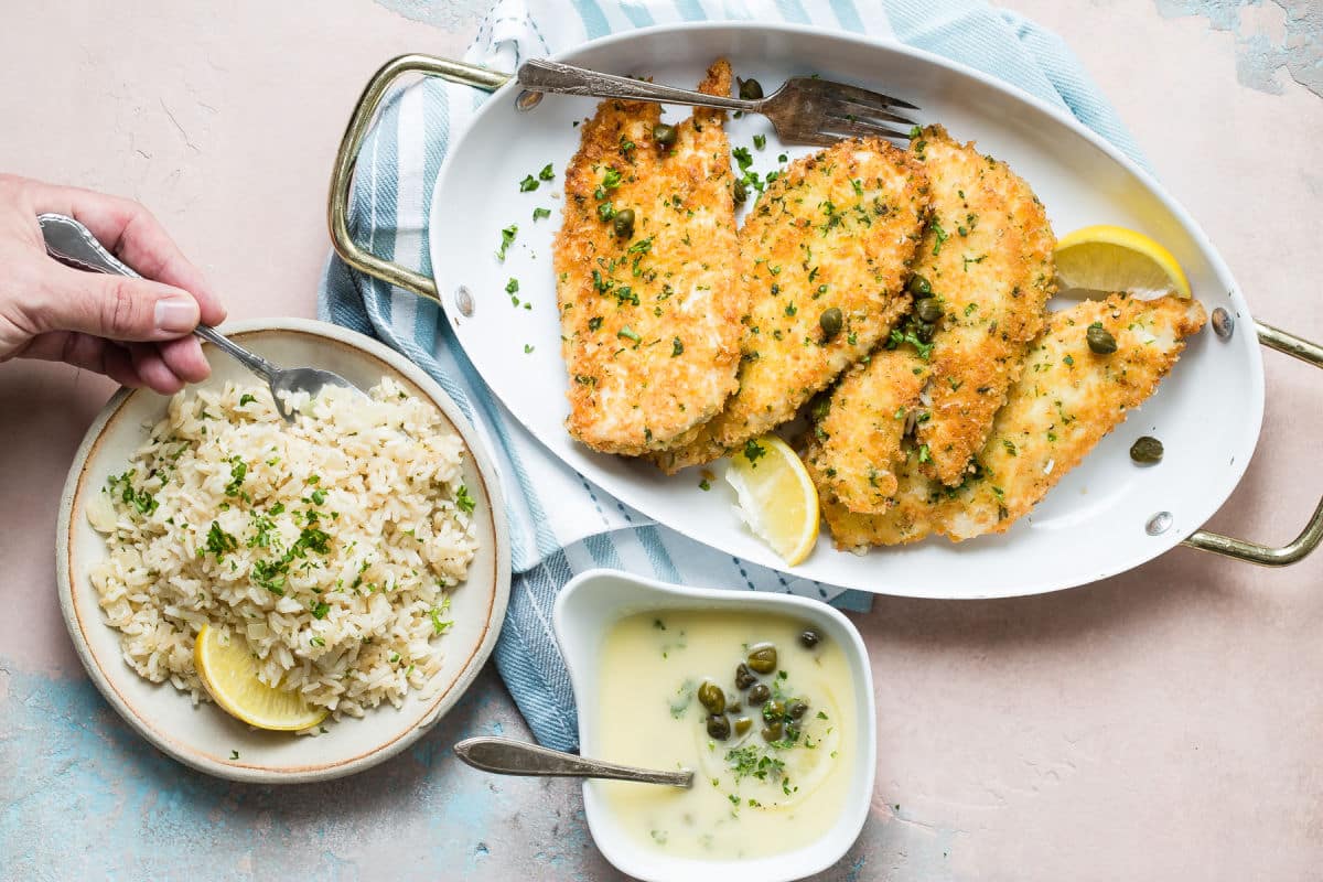 Plates of Chicken Piccata with Lemon Rice Pilaf.