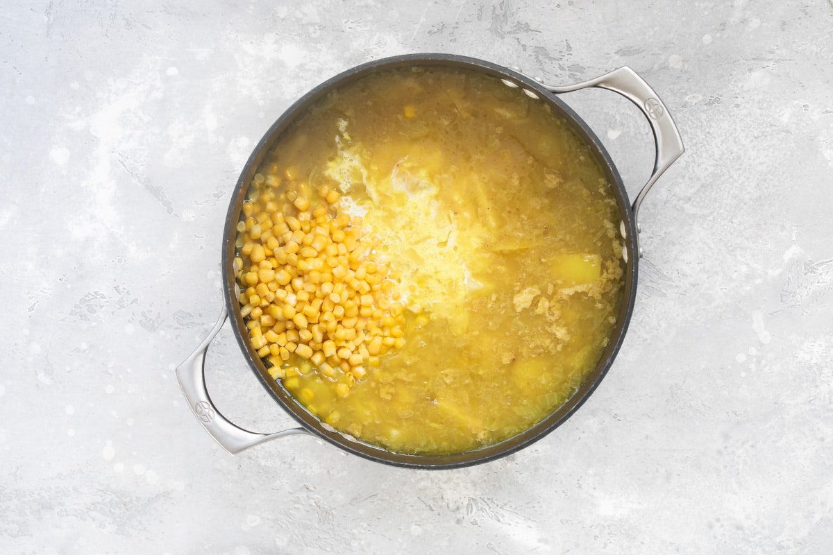Corn chowder ingredients in a pot.