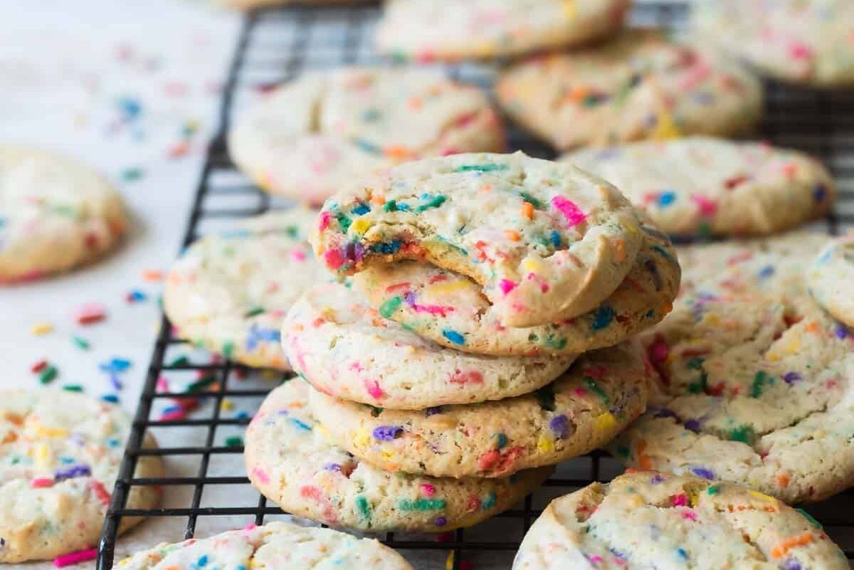 A cooling rack full of funfetti cookies.