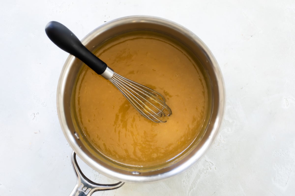 Making caramel frosting in a saucepan.