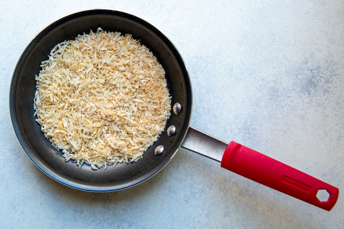 A skillet of toasted coconut.