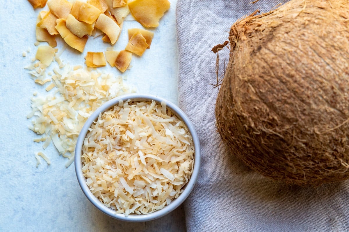 A bowl of toasted coconut.