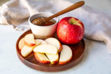A plate of apples and honey for Rosh Hoshanah.