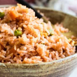 Spanish rice in a brown bowl.