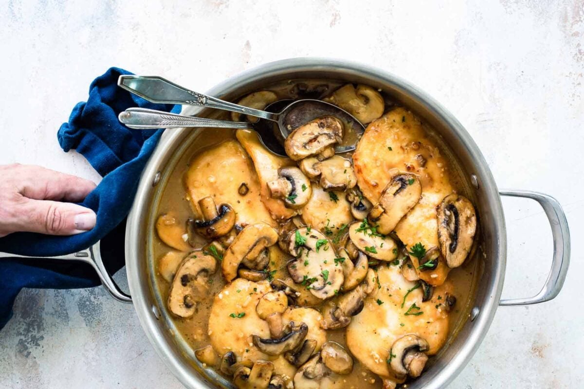 A pan of Chicken Marsala with mushrooms.