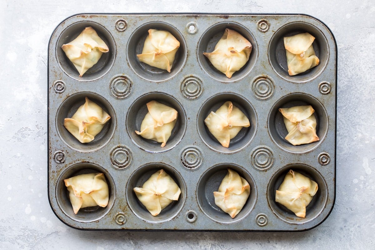 Crab Rangoons after baking in a muffin tin.