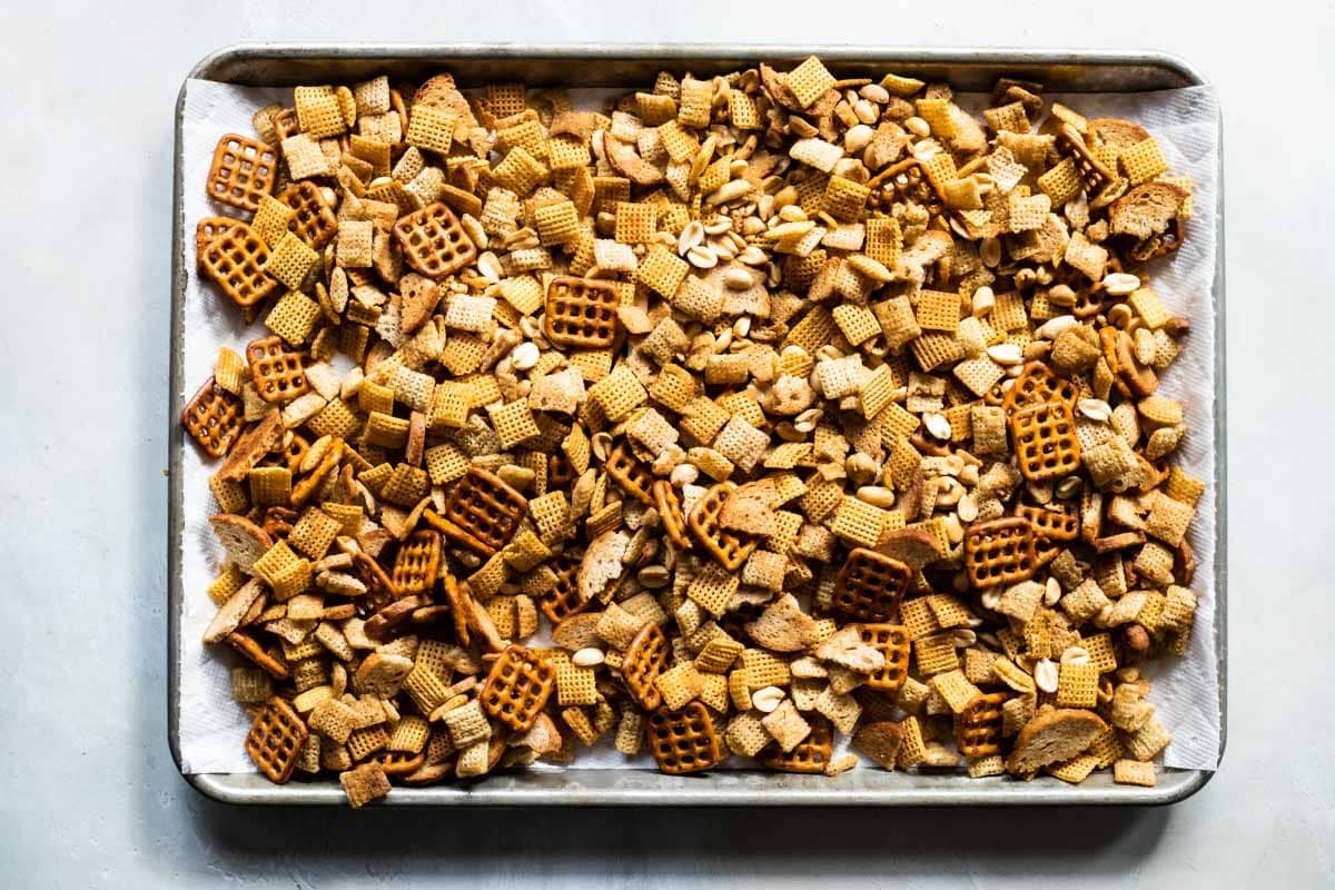 A baking sheet full of chex mix.