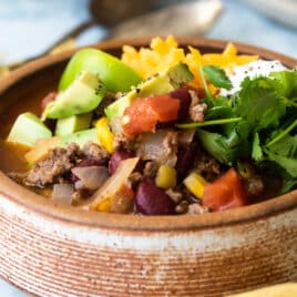 Easy taco soup in a brown bowl.