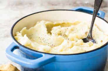 The Best Mashed Potatoes in a blue Dutch oven.