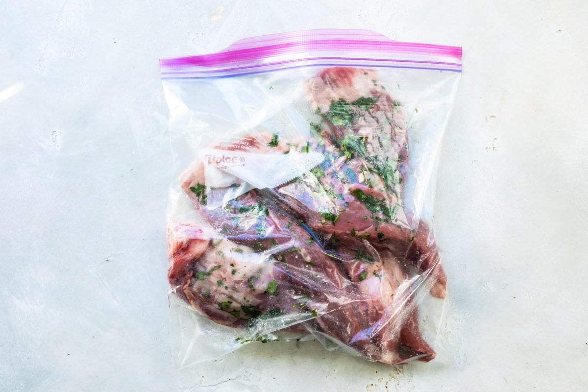 Chimichurri steak marinating in a ziploc bag.
