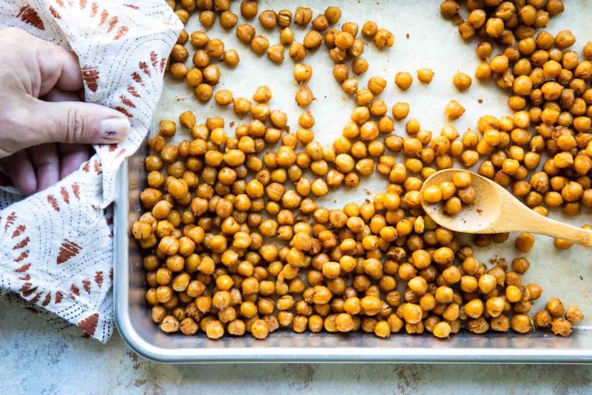 A baking sheet full of roasted chickpeas.