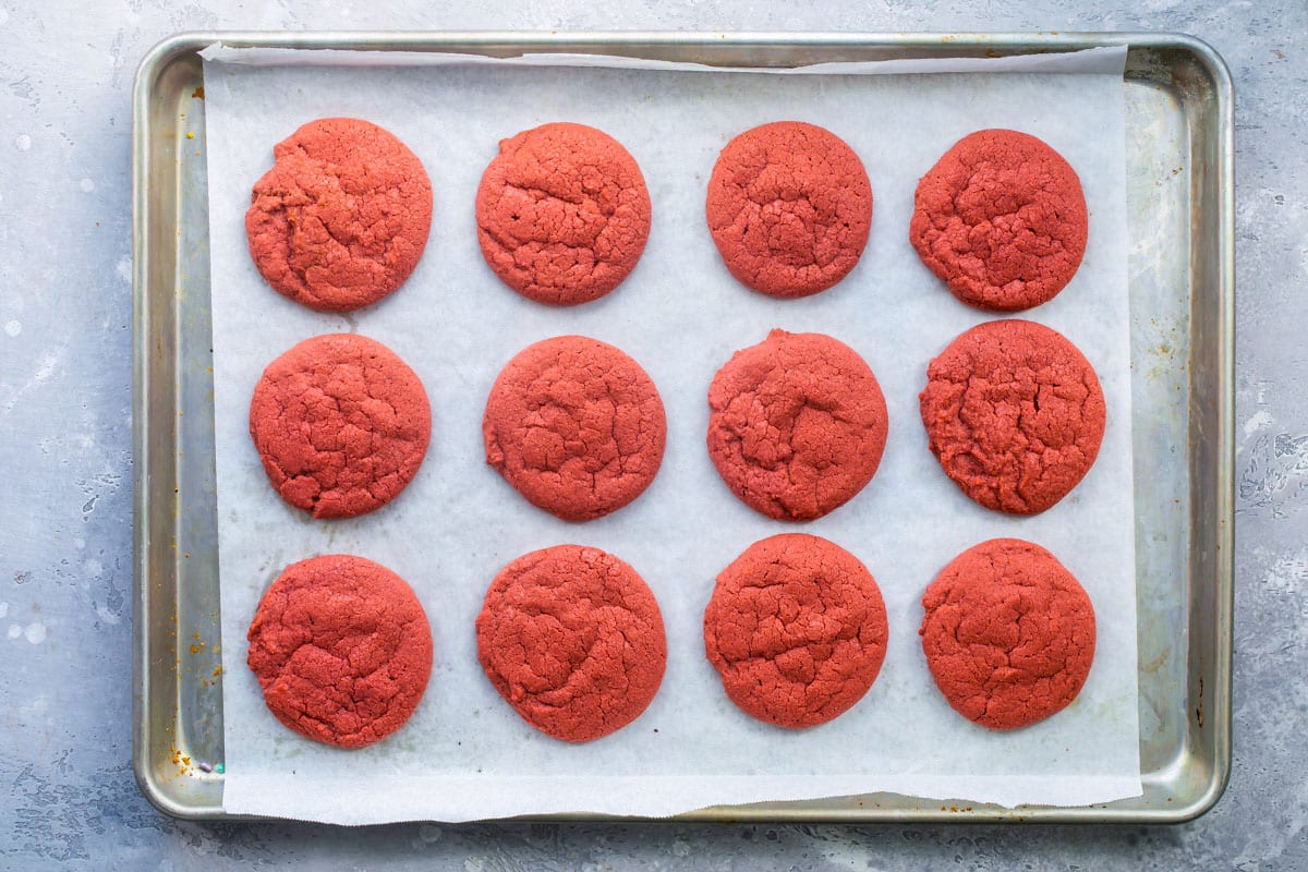 Unfrosted peppermint cookies on a baking sheet.