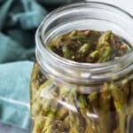 Pickled asparagus in a mason jar.