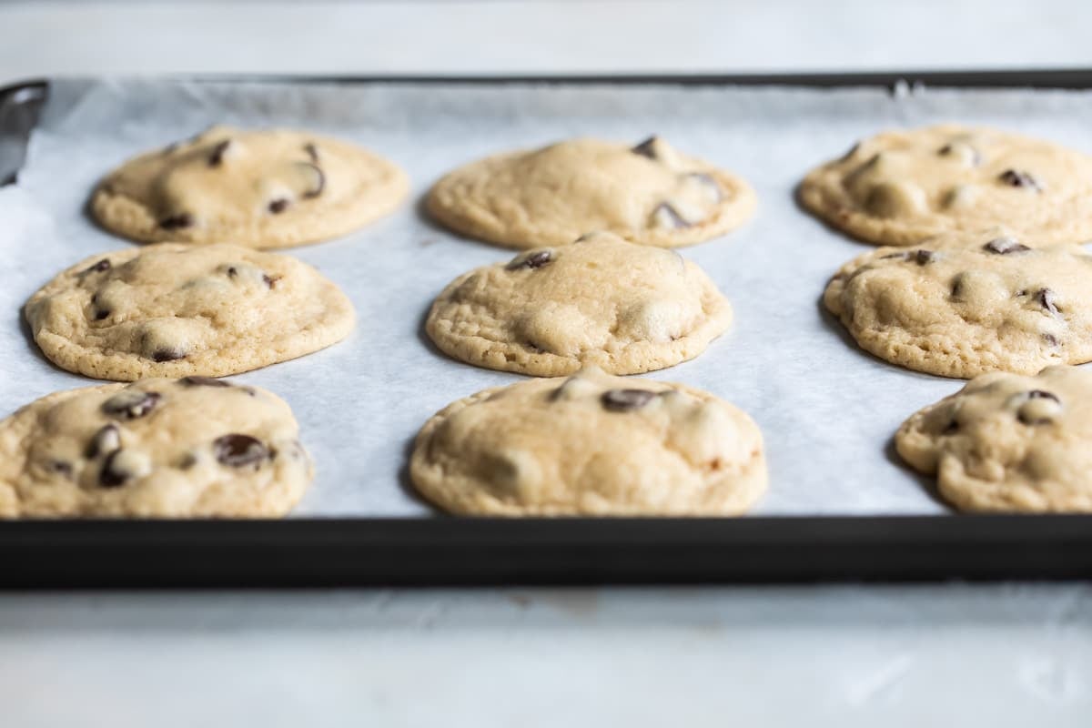 Chocolate chip cookies on a baking sheet.