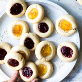 Thumbprint cookies on a gray plate.