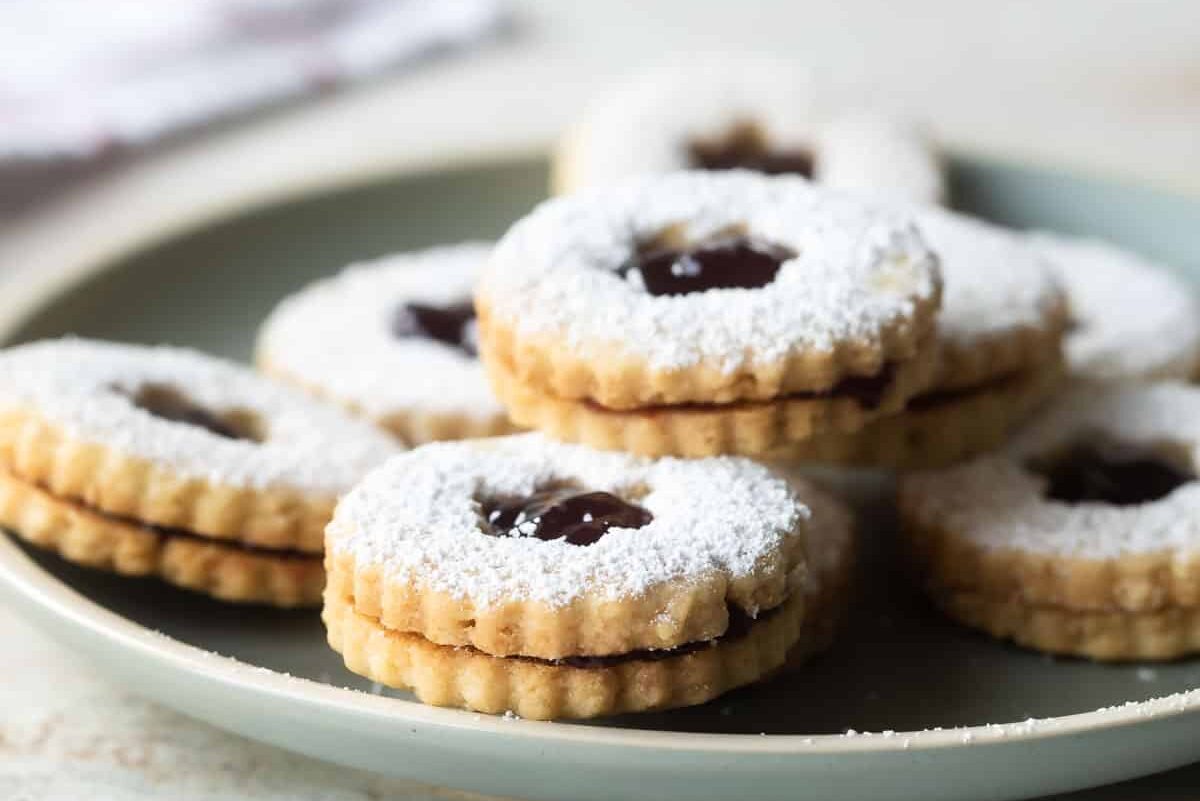 A blue plate with linzer cookies.