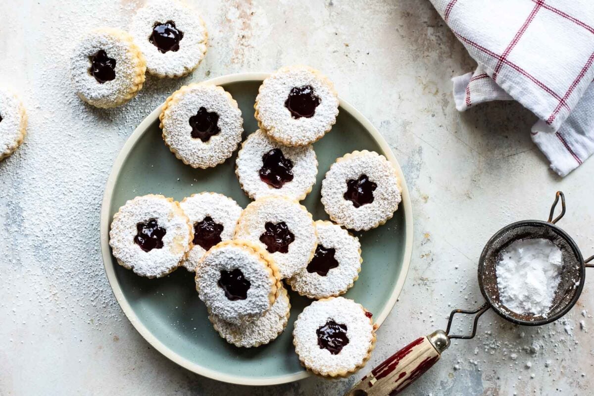 A blue plate with linzer cookies.