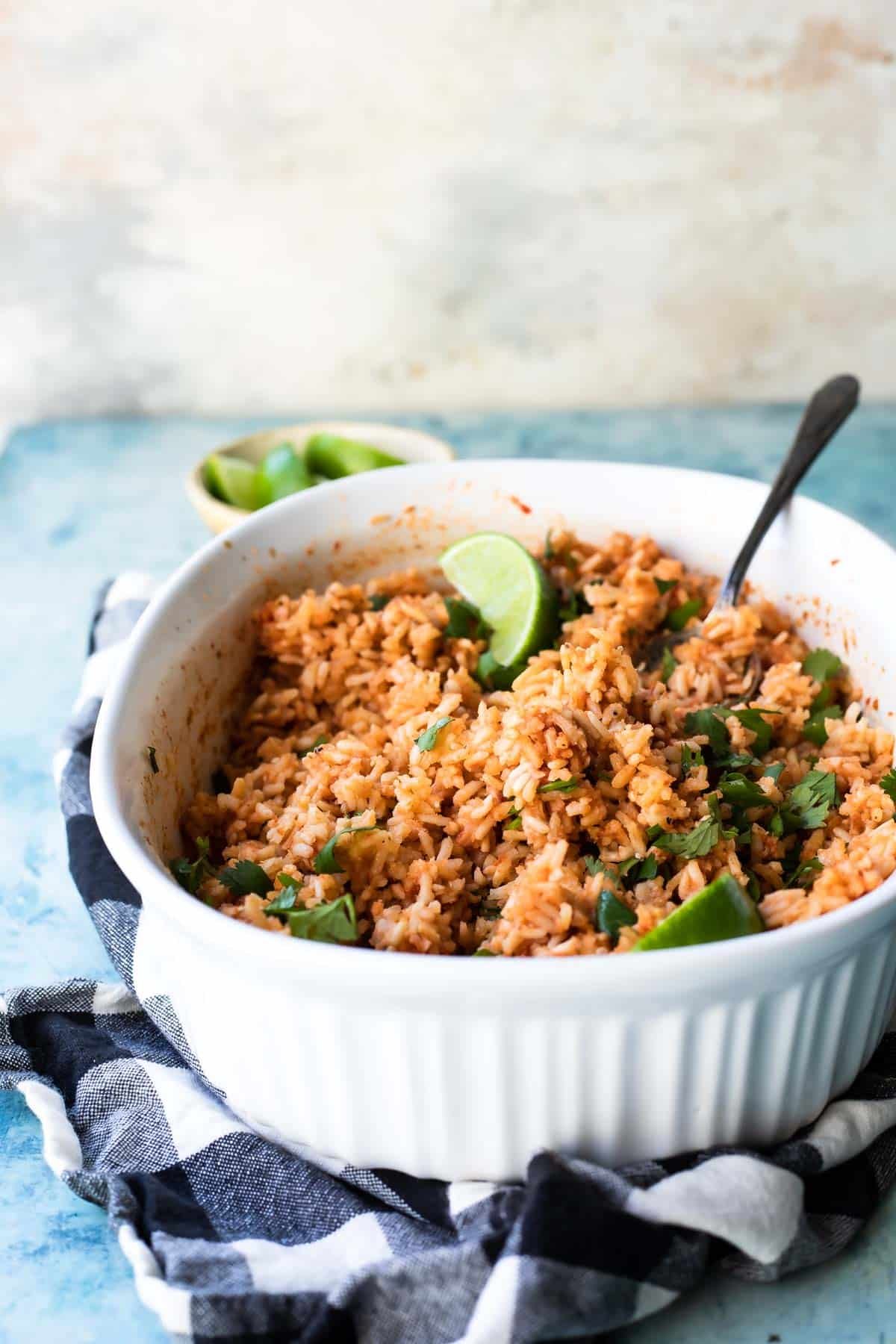 Mexican rice in a white serving dish.