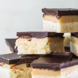 Squares of millionaire's shortbread on a plate.