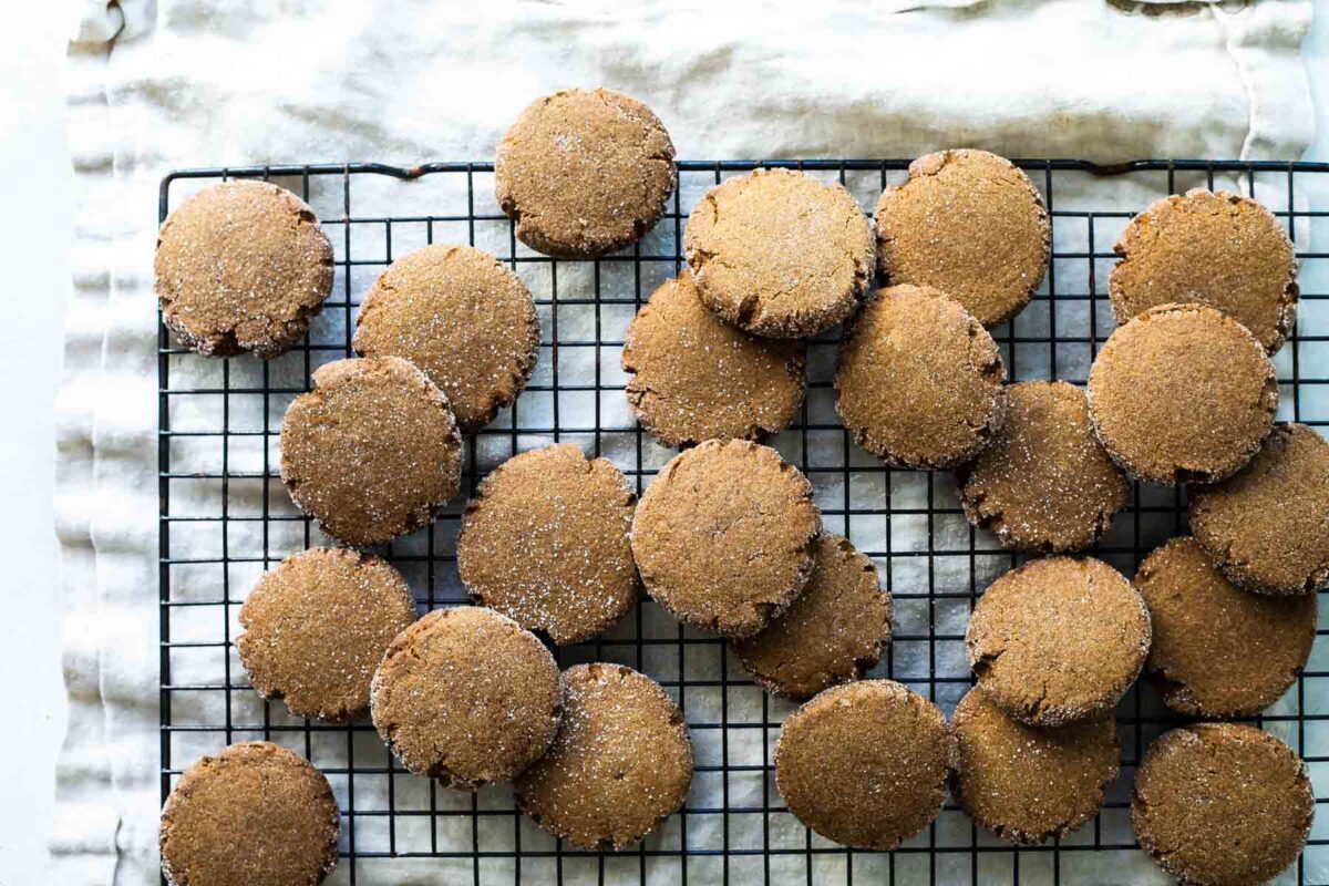 Molasses cookies on a cooling rack.