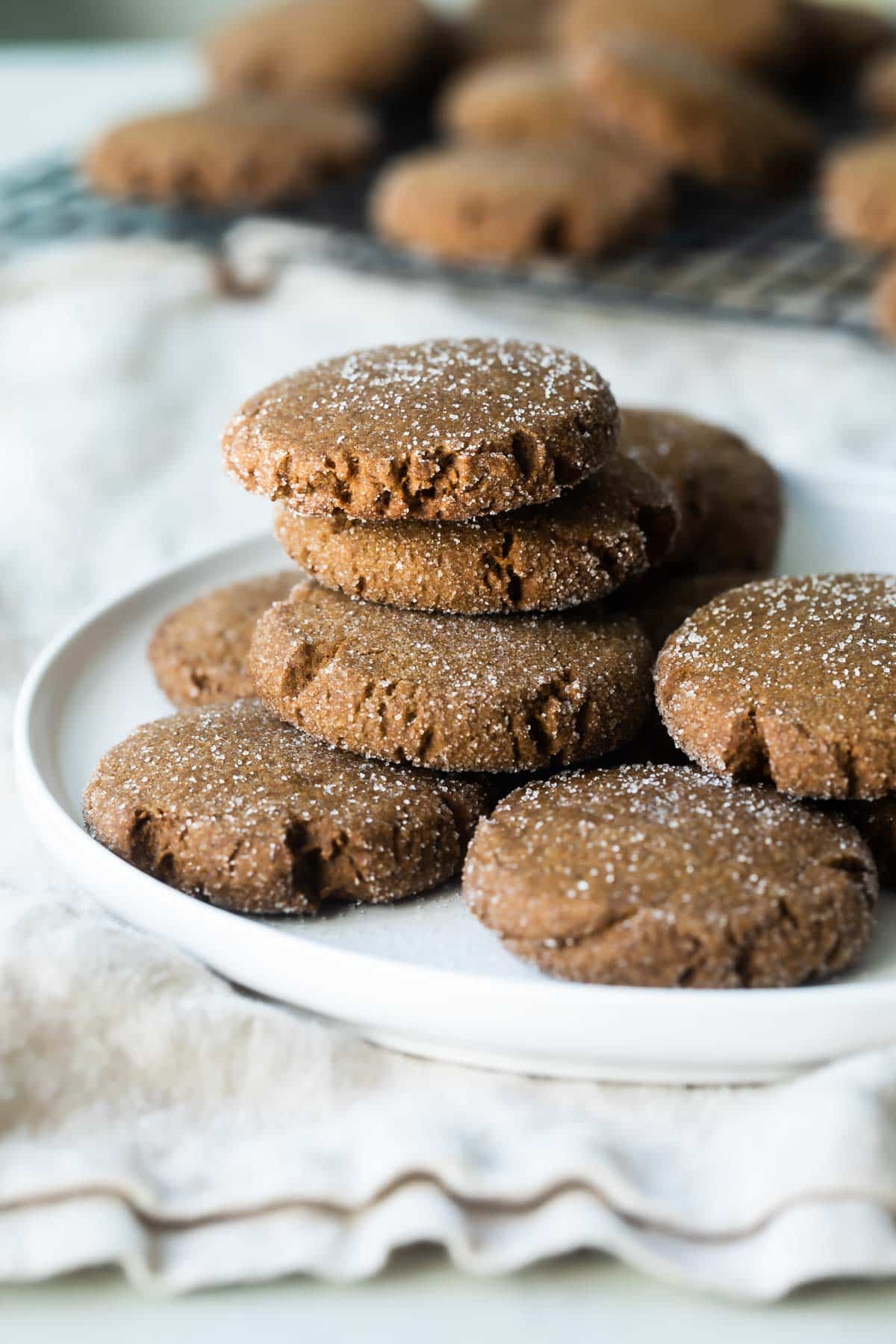 Molasses cookies on a small white plate.