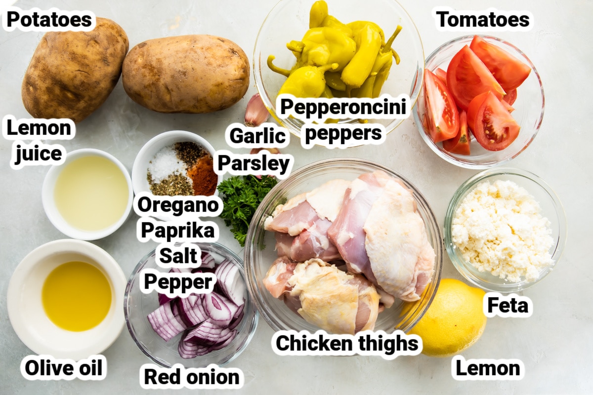 Labeled ingredients for sheet pan Greek chicken.