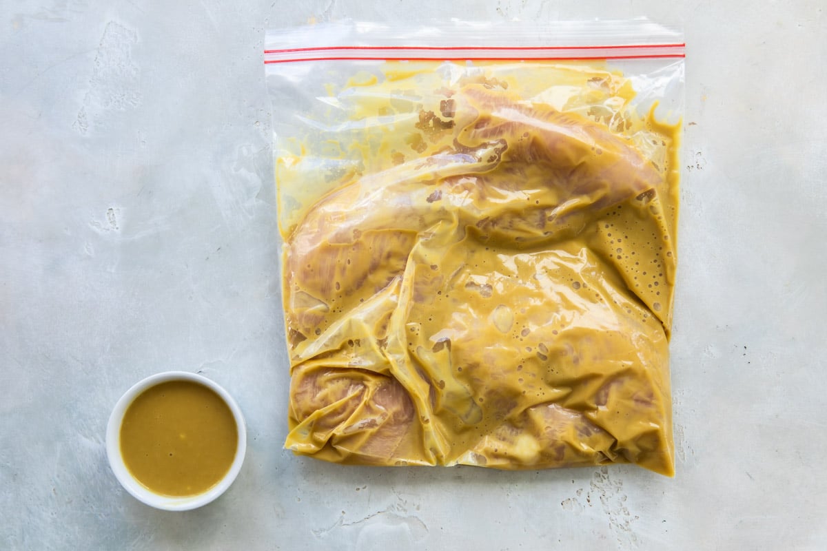 Alice springs chicken marinating in a zippered bag.