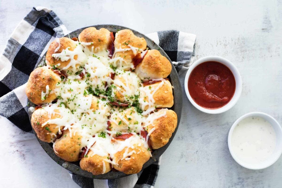 Pepperoni pizza bites in a gray pan.