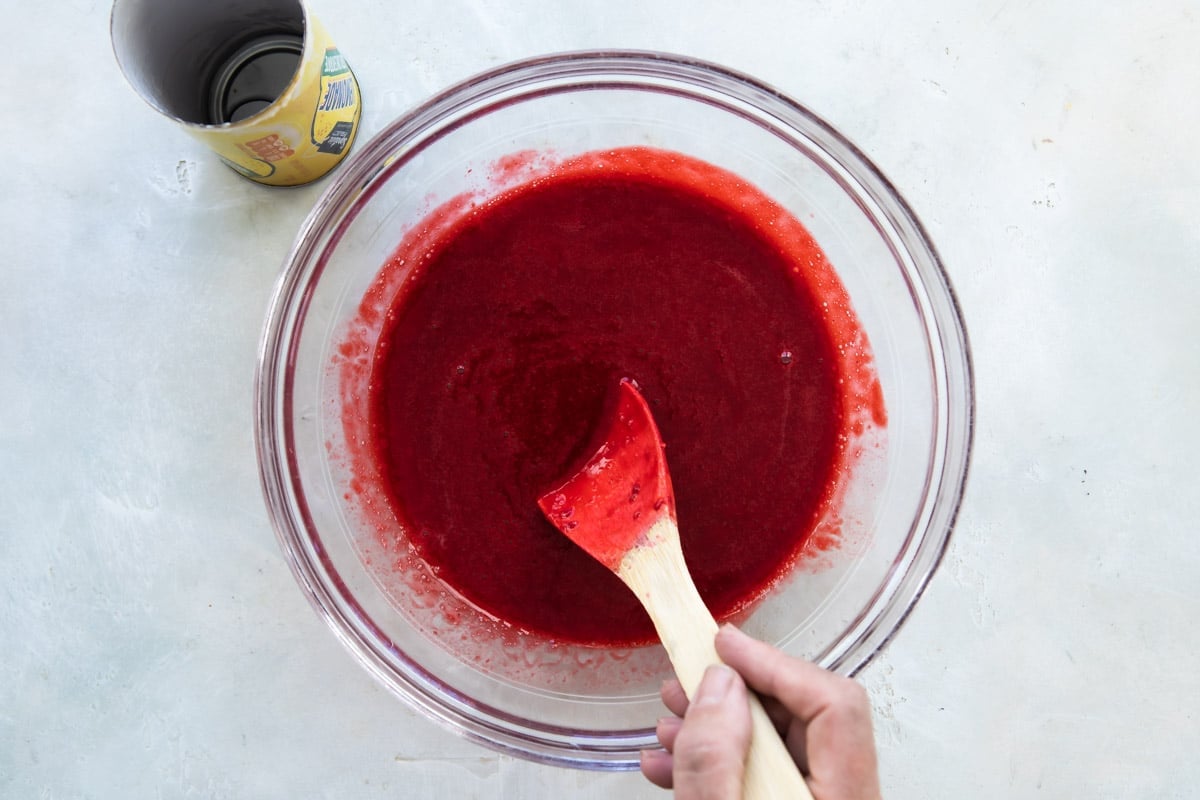 A bowl of strained raspberry puree.