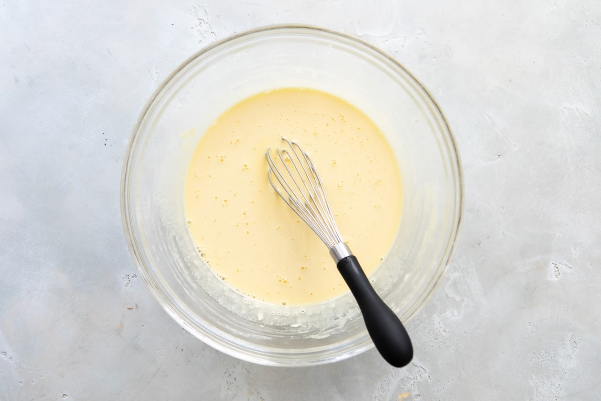 Half of the hot milk added to the custard for pastry cream.