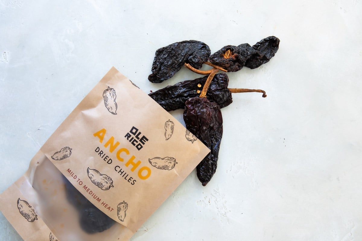 An open bag of dried ancho chiles.
