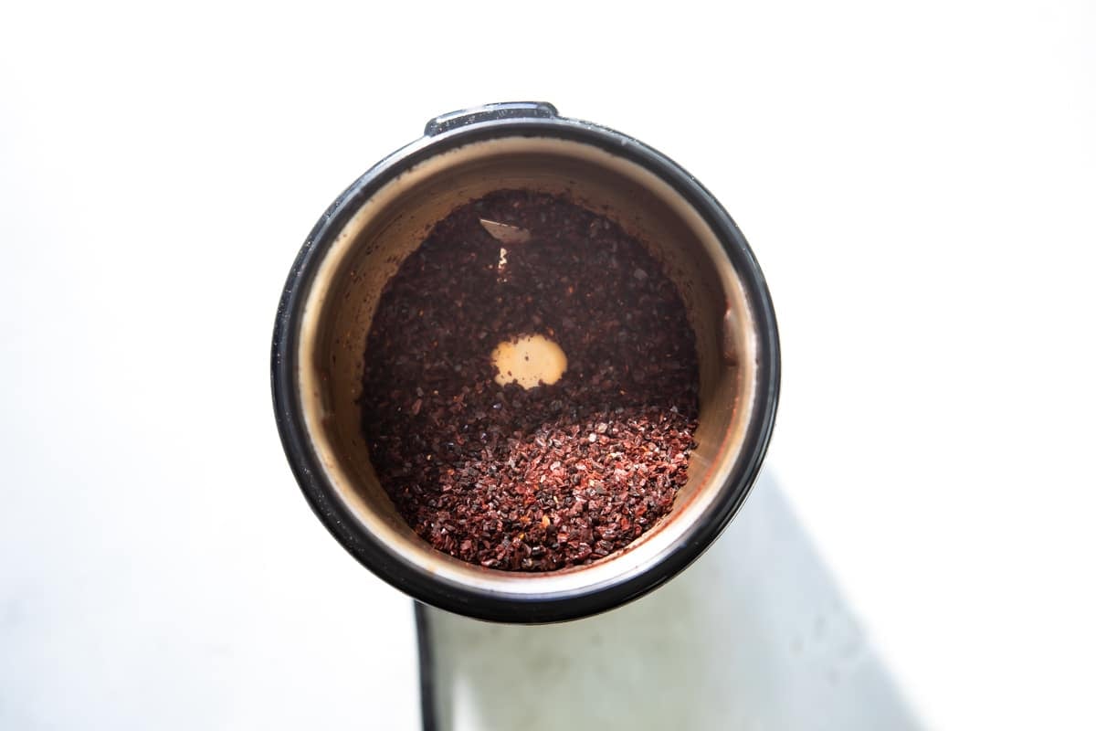 Ancho chile powder in a spice grinder.