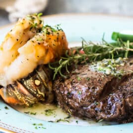Surf and turf on a blue plate.