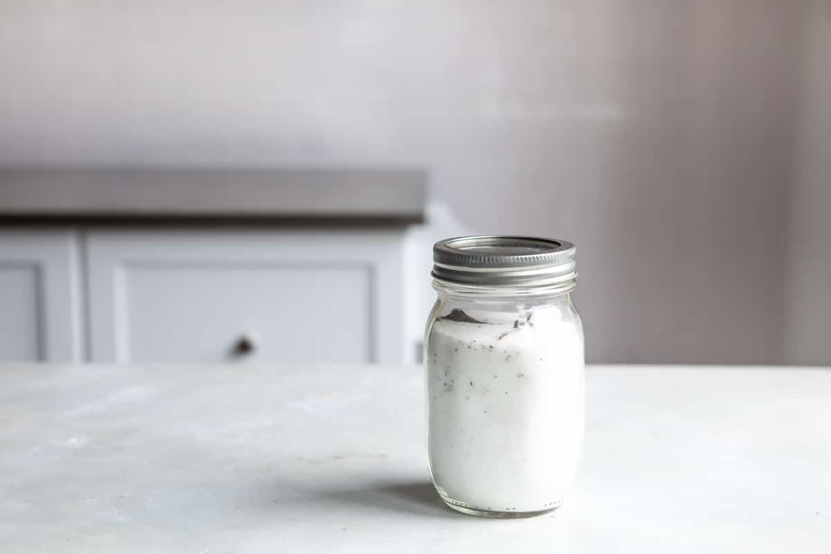 A mason jar filled with vanilla sugar.
